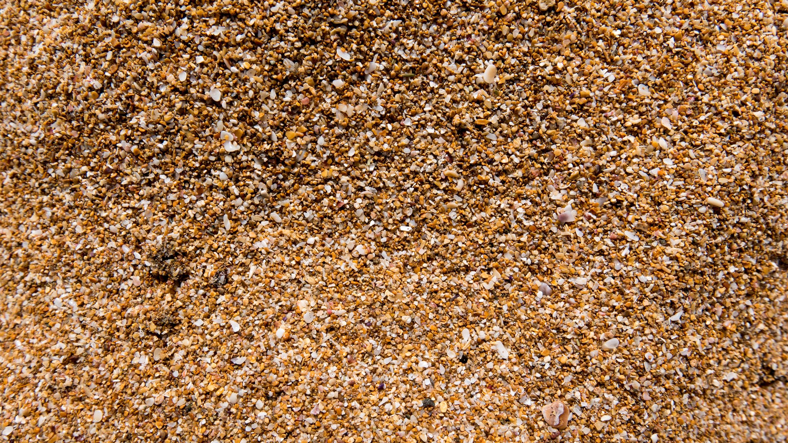Illustrative photo of sand texture — not the material of our producers.